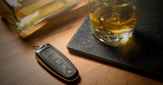 alcohol and car keys on the table
