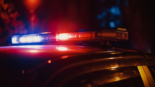 Close-up shot of police lights on top of a police cruiser. | Law Office of Russell B. McCormick, PA