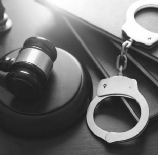 hand cuffs and gavel